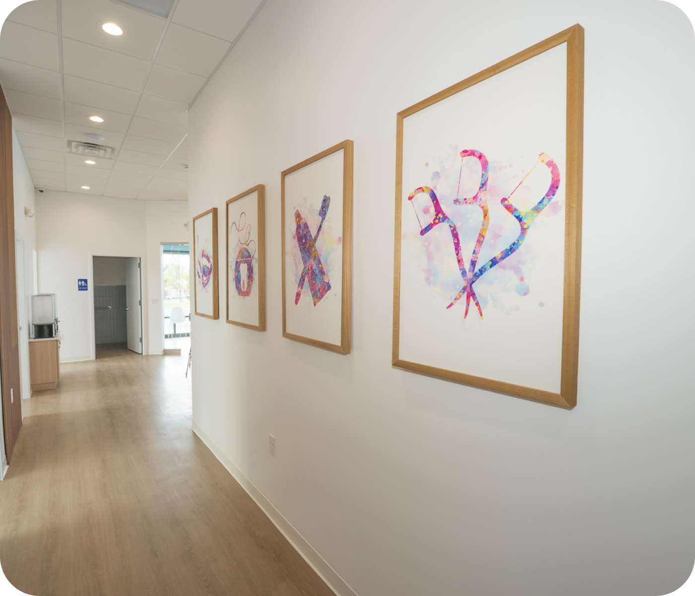 Hallway inside Everyday Smiles Pediatric Dentistry in New Windsor, NY with colorful dental artwork