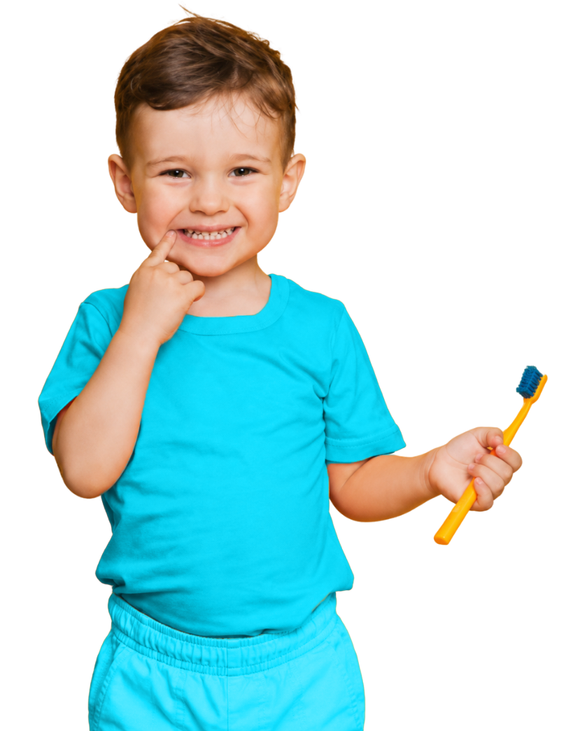 Smiling young child holding a toothbrush for pediatric dental care